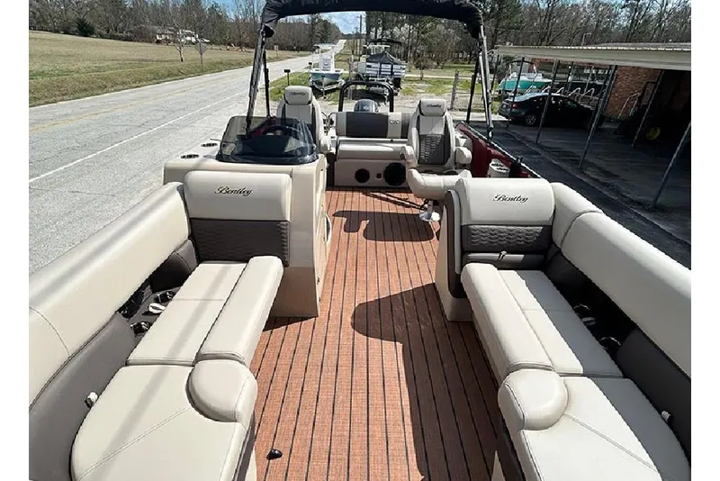 Slide: The Image of 2026 Bentley Pontoons 223 Elite Swingback DC with luxurious seating and spacious deck. - 9