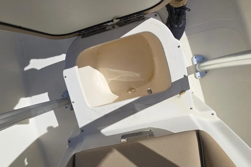 Slide: The Image of 2016 Scout 177 Sport boat interior with open storage compartment. - 10