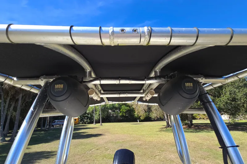 Slide: The Image of 2016 Scout 177 Sport boat with MB Quart speakers and metal frame under clear blue sky. - 4