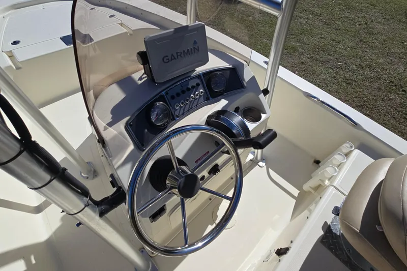 Slide: The Image of 2016 Scout 177 Sport boat dashboard with Garmin GPS and steering wheel. - 8