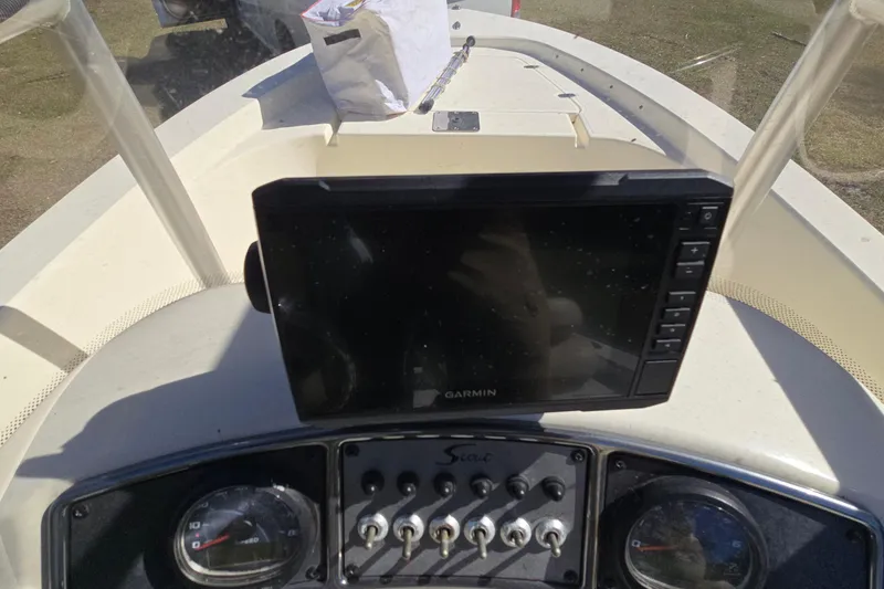 Slide: The Image of 2016 Scout 177 Sport boat dashboard with Garmin GPS and control panel. - 9