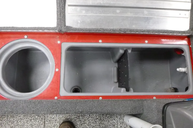 Slide: The Image of 2015 Tracker Pro Guide V-16 SC boat storage compartments, featuring red and gray interior design. - 10