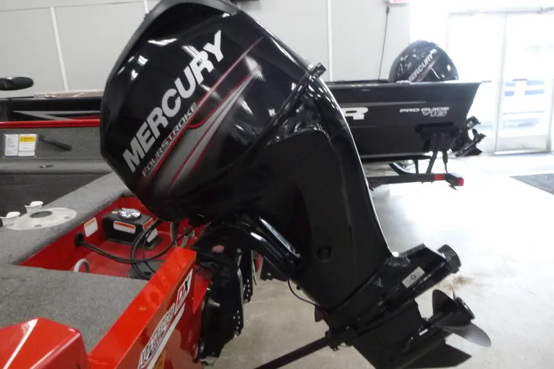 Slide: The Image of 2015 Tracker Pro Guide V-16 SC with Mercury FourStroke outboard motor in showroom. - 15