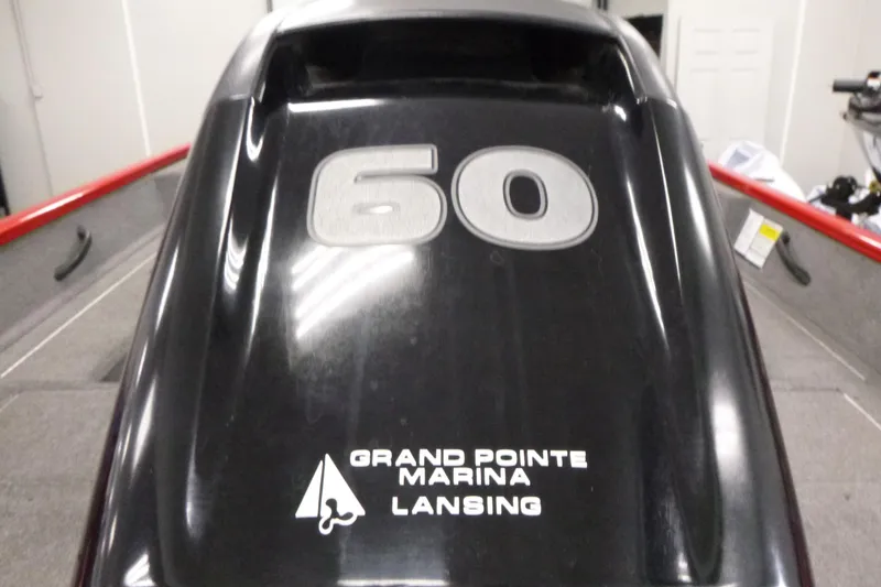 Slide: The Image of 2015 Tracker Pro Guide V-16 SC boat with "60" and Grand Pointe Marina Lansing logo. - 16