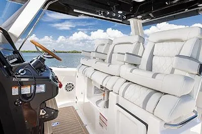 Slide: The Image of 2026 Pursuit S 388 Sport boat interior with luxurious seating and modern helm. - 12