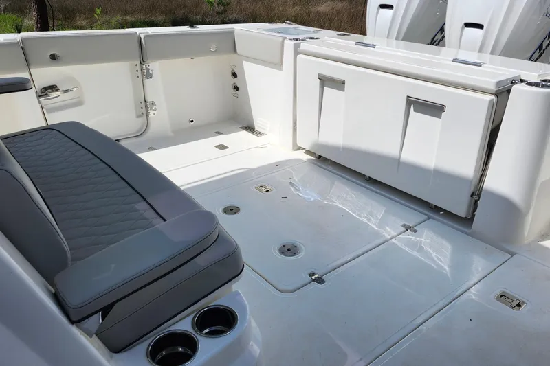 Slide: The Image of Interior of 2026 Pursuit S 388 Sport boat with seating and storage compartments. - 23