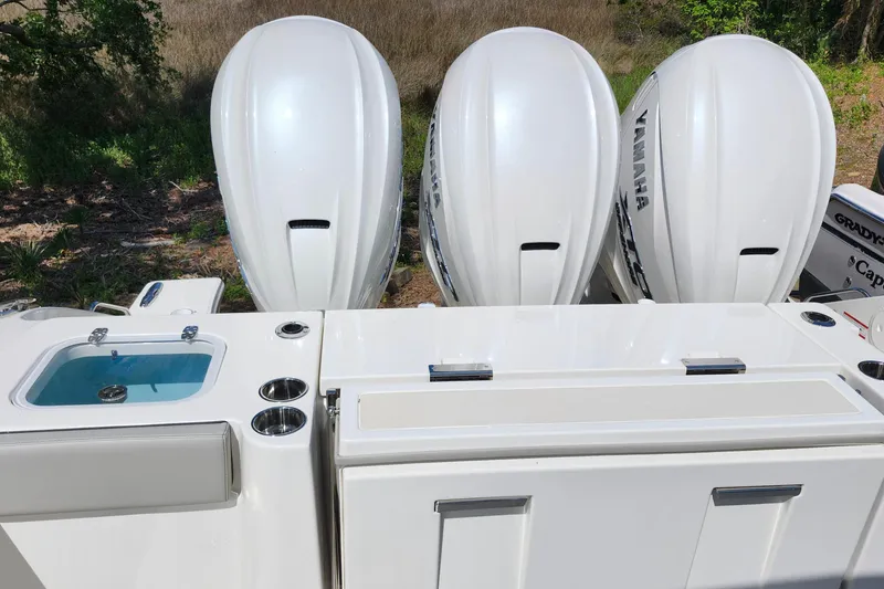 Slide: The Image of 2026 Pursuit S 388 Sport boat with triple Yamaha outboard engines. - 26