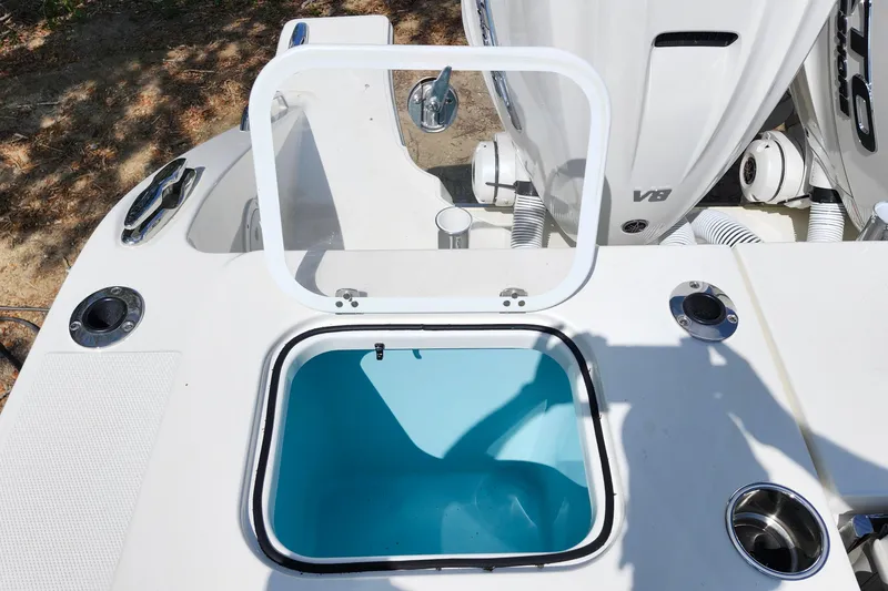 Slide: The Image of Open hatch on 2026 Pursuit S 388 Sport boat, revealing storage compartment. - 27