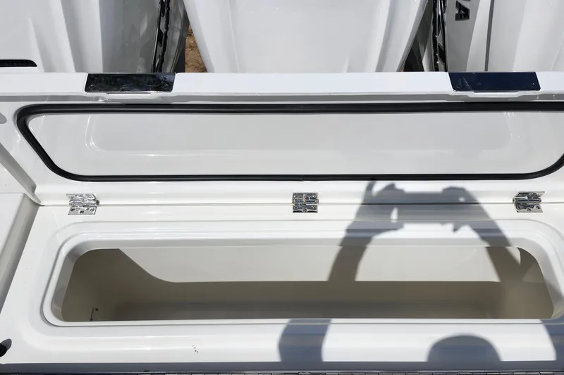 Slide: The Image of Open storage compartment on 2026 Pursuit S 388 Sport boat, showing interior space. - 28