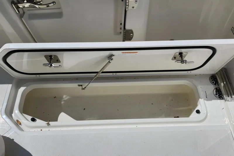 Slide: The Image of Open storage compartment on 2026 Pursuit S 388 Sport boat. - 31