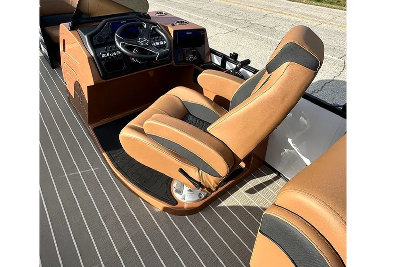 Slide: The Image of 2026 Bentley Pontoons Elite 223 Admiral interior with luxurious captain's chair and modern dashboard. - 12