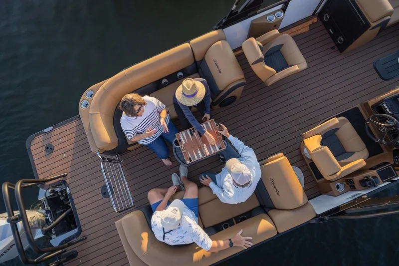 Slide: The Image of Manufacturer Provided Image: People enjoying a game on a 2026 Bentley Pontoons Elite 223 Admiral boat. - 2