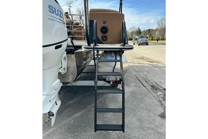 Slide: The Image of 2026 Bentley Pontoons Elite 223 Admiral with ladder and Suzuki outboard motor. - 23