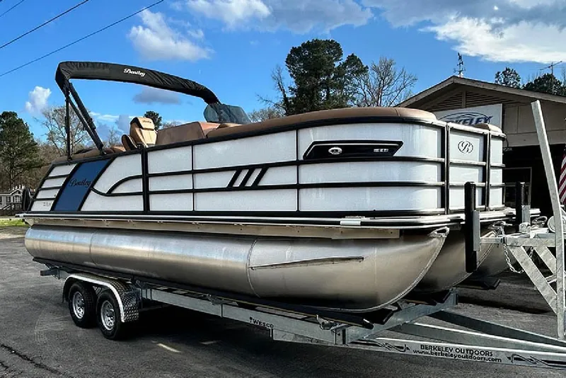 Slide: The Image of 2026 Bentley Pontoons Elite 223 Admiral on trailer, sleek design under blue sky. - 6