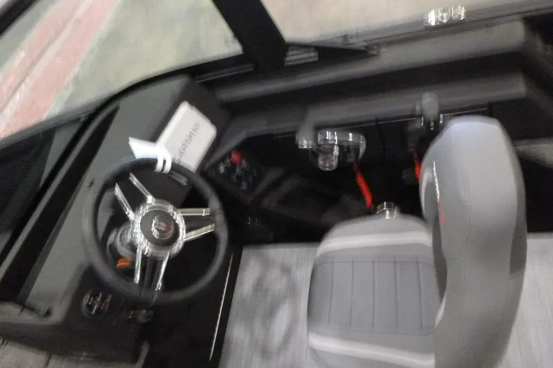 Slide: The Image of Interior view of 2025 Alumacraft Competitor 195X Sport boat cockpit. - 10
