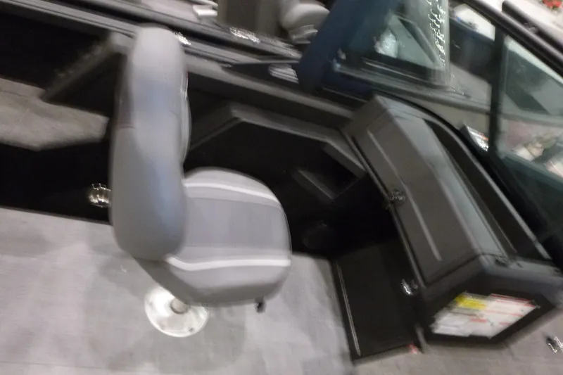 Slide: The Image of Interior of 2025 Alumacraft Competitor 195X Sport boat with gray seating and dashboard. - 12