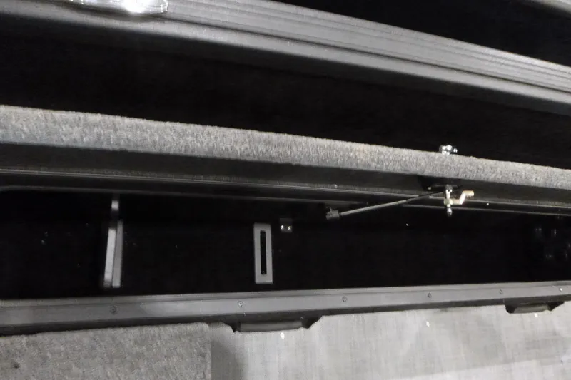 Slide: The Image of 2025 Alumacraft Competitor 195X Sport storage compartment interior view. - 16