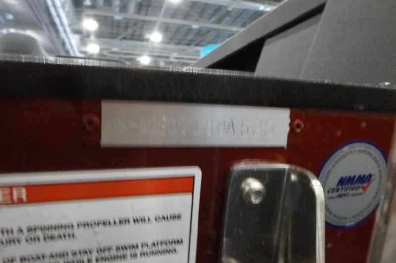 Slide: The Image of 2025 Alumacraft Competitor 195X Sport boat identification plate and safety warning label. - 19