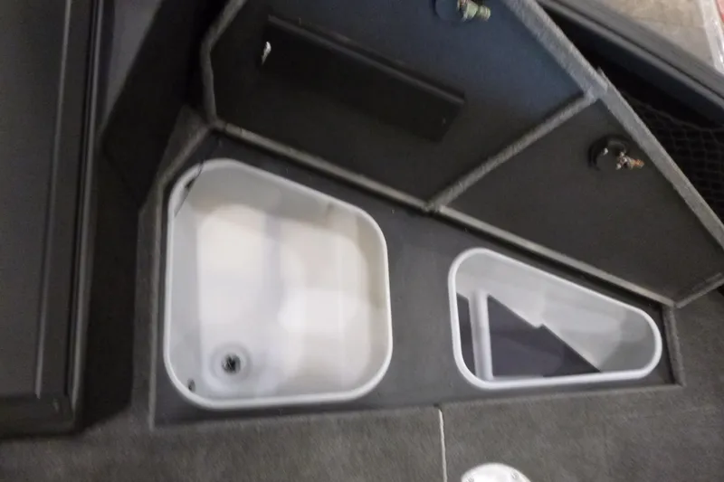 Slide: The Image of 2025 Alumacraft Competitor 195X Sport boat storage compartments, featuring durable design and ample space. - 9