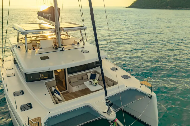 Slide: The Image of Luxurious Island Spirit 525E yacht sailing on serene waters at sunset, 2026 model. - 14