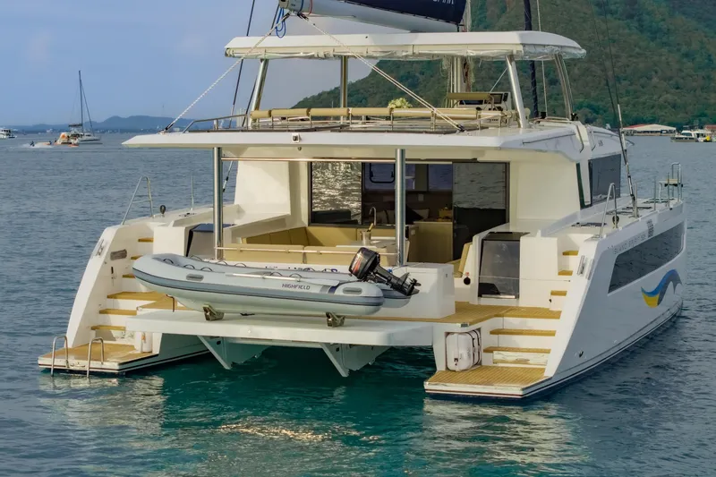 Slide: The Image of Luxury Island Spirit 525E catamaran, 2026 model, anchored in serene waters. - 15