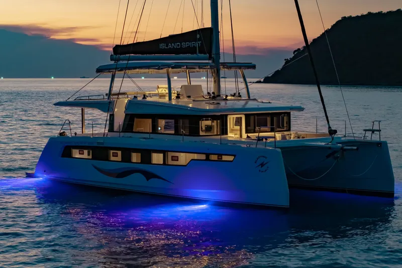 Slide: The Image of Luxurious Island Spirit 525E catamaran illuminated at sunset, 2026 model. - 18