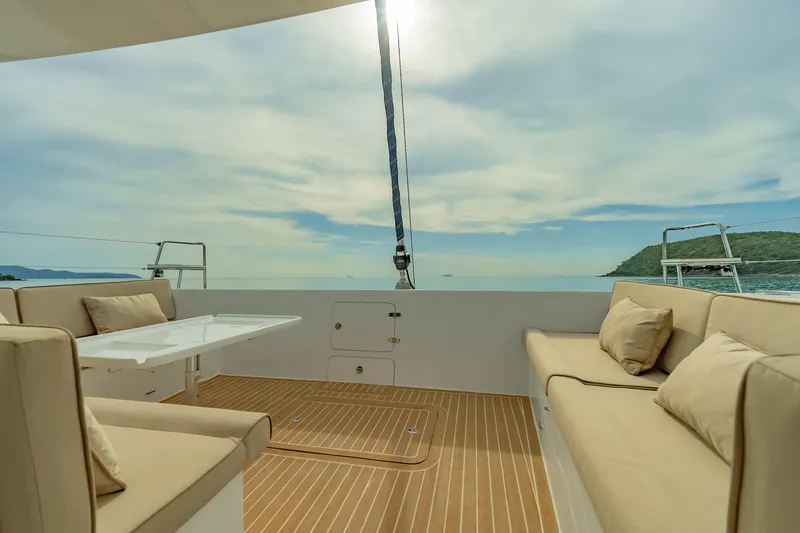 Slide: The Image of Luxurious Island Spirit 525E yacht deck with seating, ocean view, and sunny sky, 2026 model. - 23