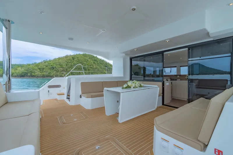 Slide: The Image of Luxurious 2026 Island Spirit 525E yacht interior with elegant seating and scenic ocean view. - 24