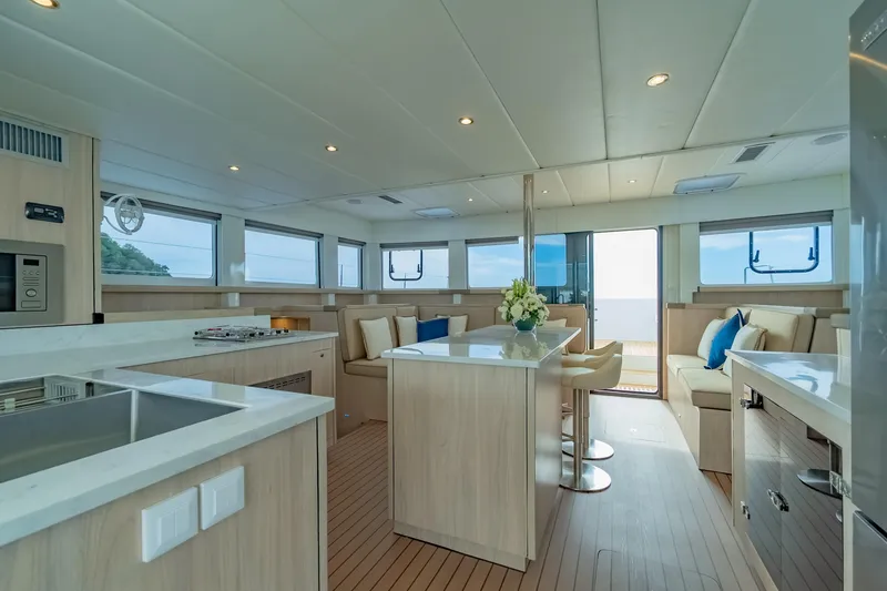 Slide: The Image of Luxurious interior of 2026 Island Spirit 525E yacht with modern kitchen and seating area. - 26
