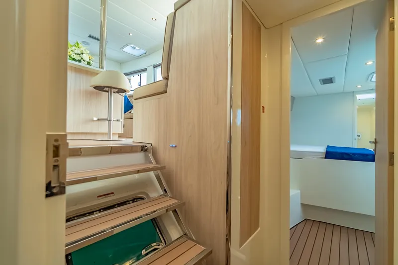 Slide: The Image of Interior of 2026 Island Spirit 525E yacht, featuring modern design and wooden stairs. - 34