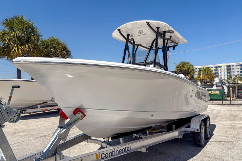 Slide: The Image of 2026 Sea Hunt Ultra 219 boat on trailer, sunny day. - 4