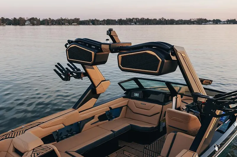 Slide: The Image of Manufacturer Provided Image: 2025 MasterCraft XStar 23 boat interior with advanced sound system on a serene lake. - 15