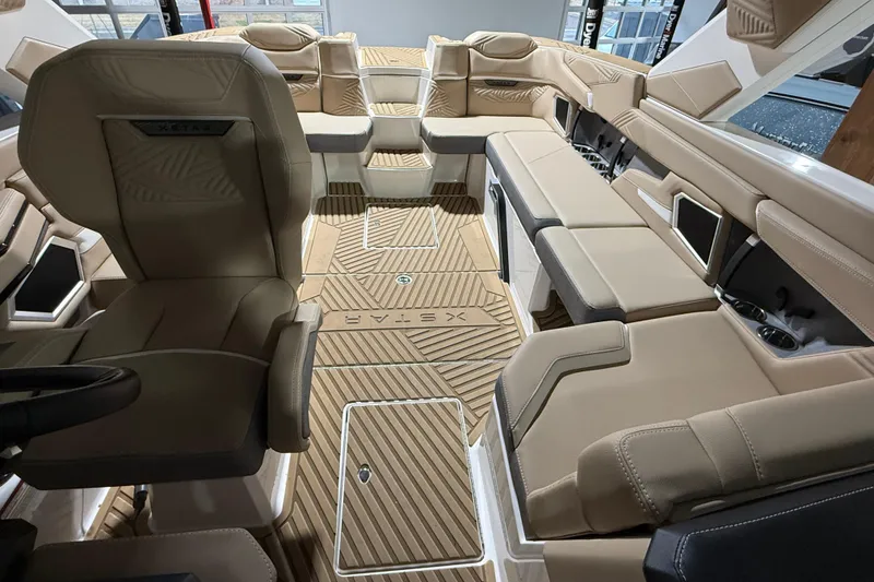 Slide: The Image of Luxurious interior of 2025 MasterCraft XStar 23 boat with beige seating and modern design. - 4