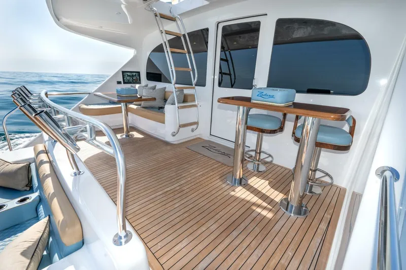 Slide: The Image of Luxurious deck of 2025 Viking 90 Convertible yacht with elegant seating and ocean view. - 106