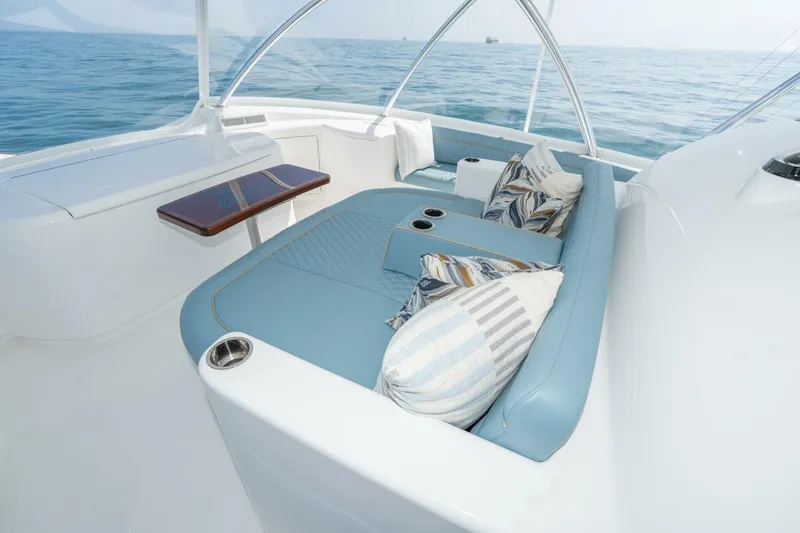 Slide: The Image of Luxurious seating area on 2025 Viking 90 Convertible yacht with ocean view. - 12