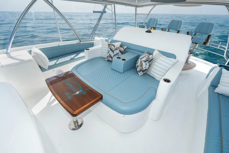 Slide: The Image of Luxurious seating area on 2025 Viking 90 Convertible yacht with ocean view. - 13