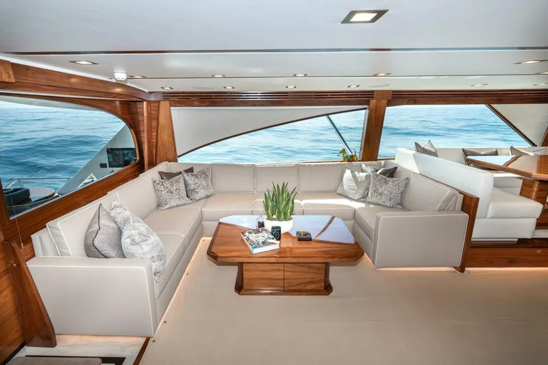 Slide: The Image of Luxurious interior of 2025 Viking 90 Convertible yacht with elegant seating and ocean view. - 16
