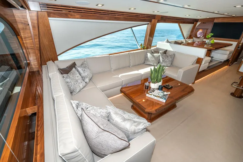 Slide: The Image of Luxurious interior of 2025 Viking 90 Convertible yacht with elegant seating and ocean view. - 17