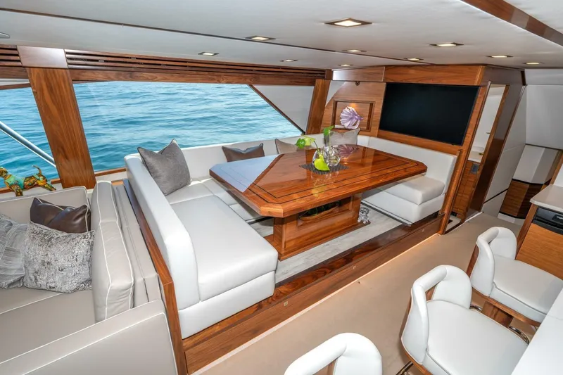 Slide: The Image of Luxurious interior of 2025 Viking 90 Convertible yacht with elegant wood finishes and ocean view. - 20