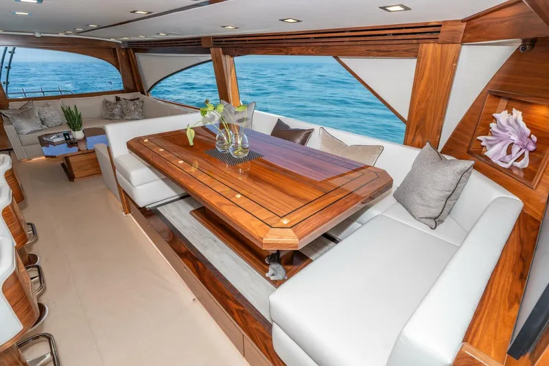 Slide: The Image of Luxurious interior of 2025 Viking 90 Convertible yacht with elegant wood and ocean view. - 21