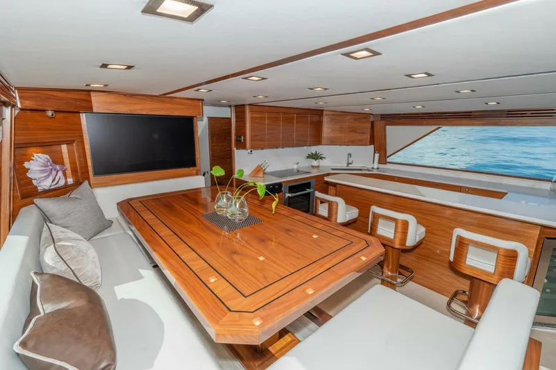 Slide: The Image of Luxurious interior of 2025 Viking 90 Convertible yacht with elegant wood finishes and modern amenities. - 25