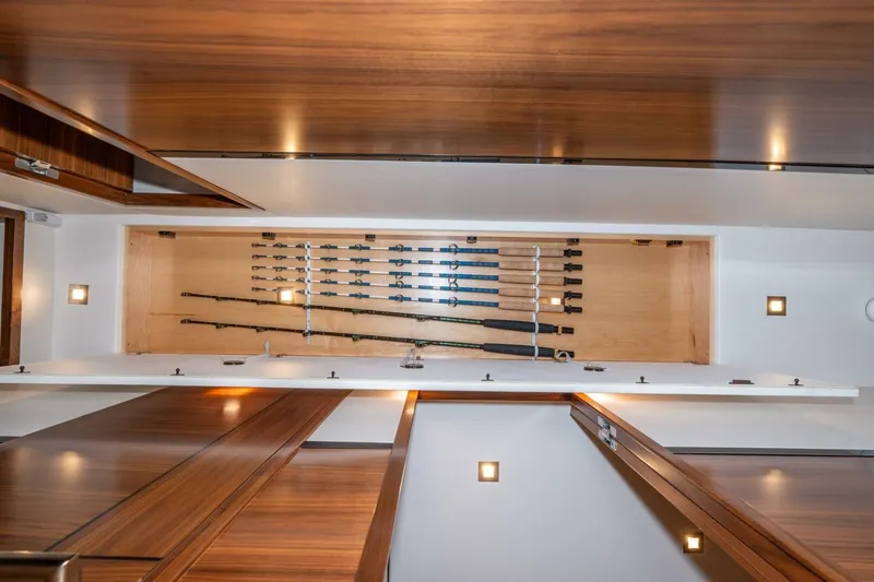 Slide: The Image of 2025 Viking 90 Convertible yacht interior with fishing rod storage. - 33