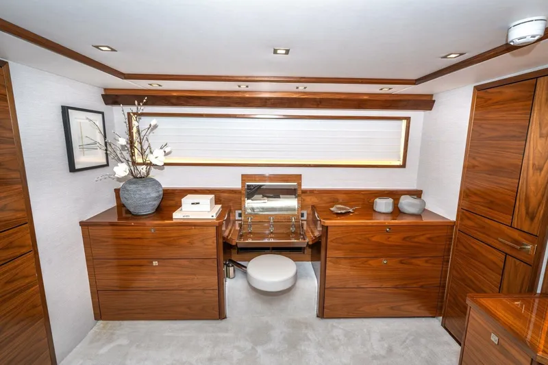 Slide: The Image of Luxurious interior of 2025 Viking 90 Convertible yacht with elegant wood cabinetry. - 36