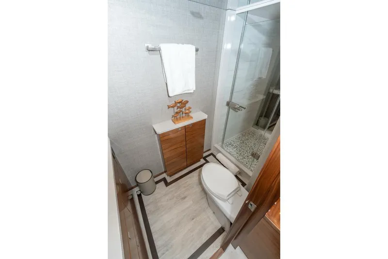 Slide: The Image of Luxurious bathroom in 2025 Viking 90 Convertible yacht with modern fixtures and elegant design. - 37