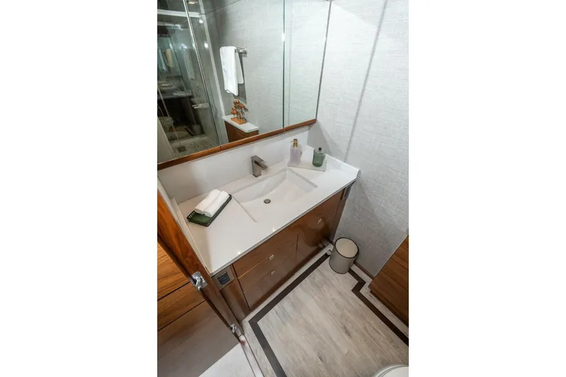 Slide: The Image of Luxurious bathroom in 2025 Viking 90 Convertible yacht with modern fixtures and elegant design. - 38