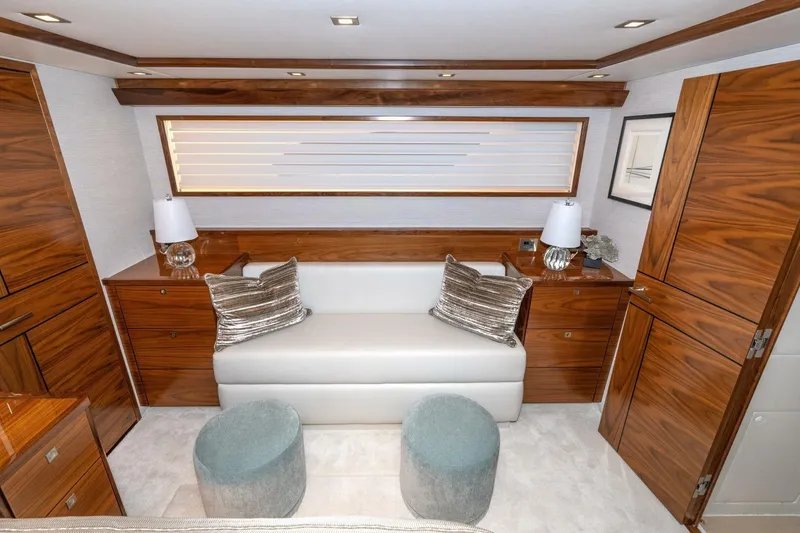 Slide: The Image of Luxurious interior of 2025 Viking 90 Convertible yacht with elegant wood finishes. - 41