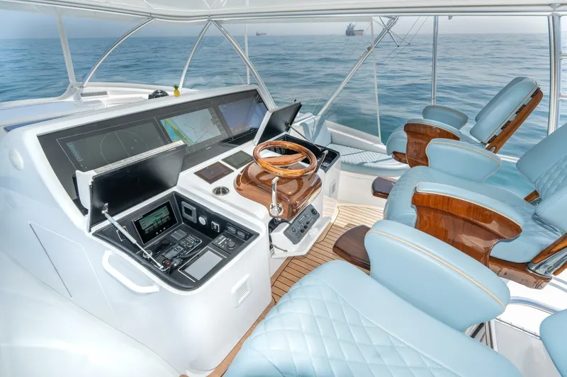 Slide: The Image of Luxurious helm of 2025 Viking 90 Convertible yacht with advanced navigation systems. - 6