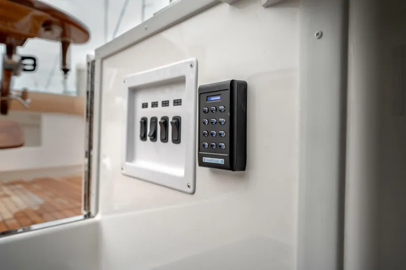 Slide: The Image of Control panel and keypad on 2025 Viking 90 Convertible yacht interior. - 69