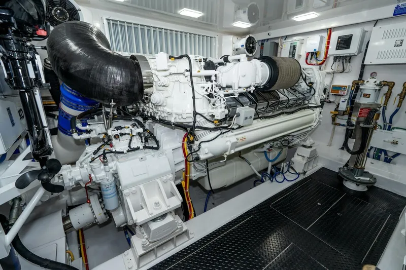 Slide: The Image of Engine room of 2025 Viking 90 Convertible yacht, showcasing advanced machinery and equipment. - 76
