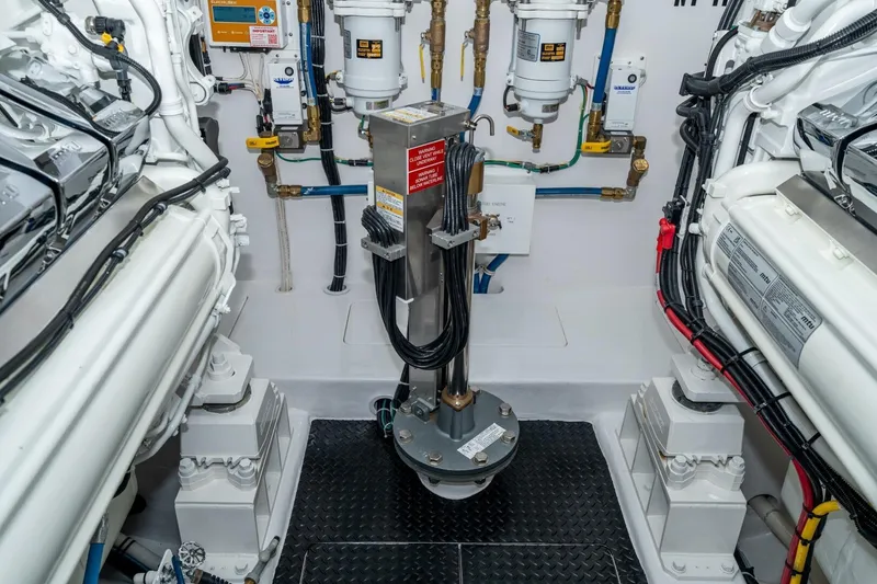 Slide: The Image of Engine room of 2025 Viking 90 Convertible yacht, showcasing advanced machinery and components. - 79
